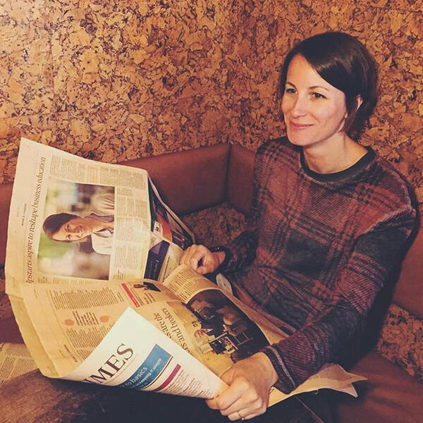 Photo of Aimee holding Financial Times with her picture in Photo of Aimee holding Financial Times with her picture in