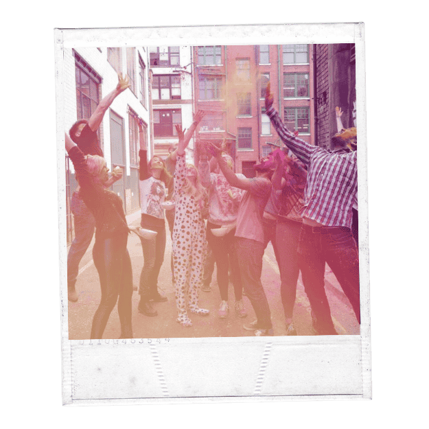 Image of group throwing colourful paint together Image of group throwing colourful paint together